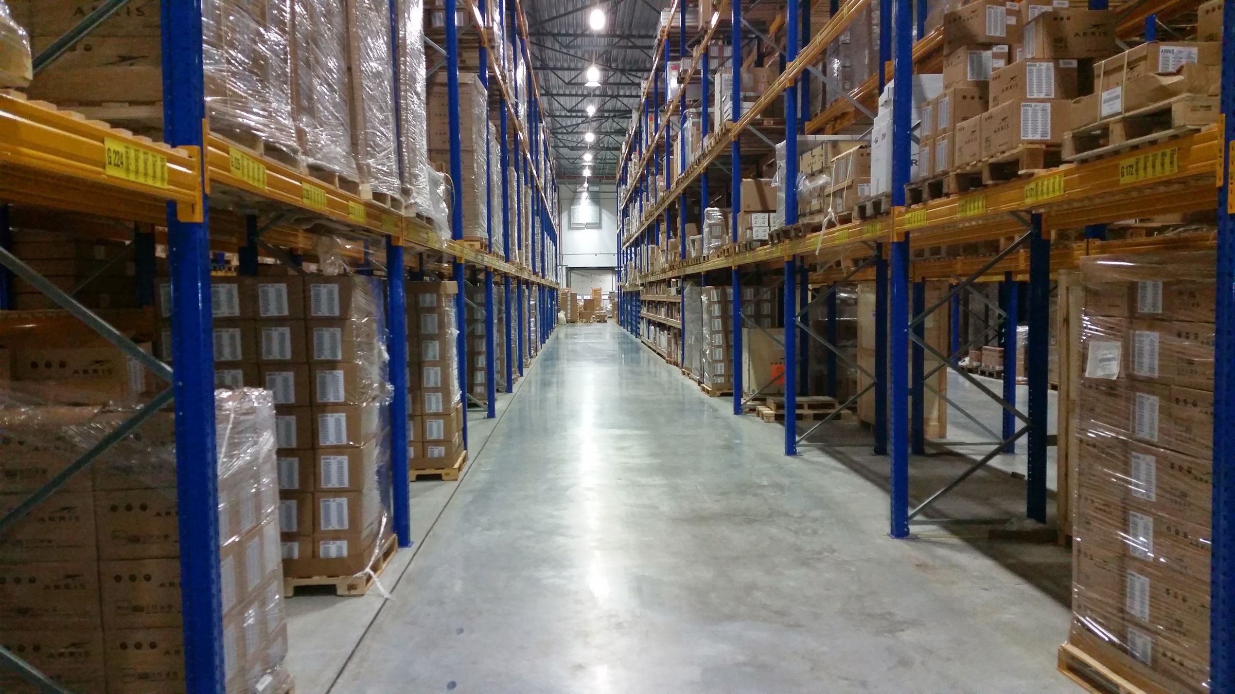Pallet racking in a warehouse aisle